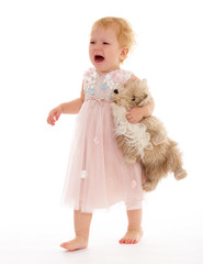 pretty little girl with a toy dog.