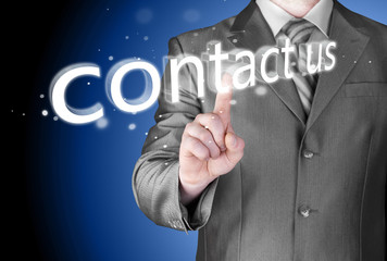 Businessman pushing CONTACT US sign