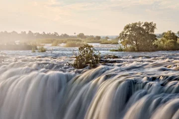 Fototapeten Victoria falls on the Zambezi river between Zambia and Zimbabwe, Africa © Delphotostock