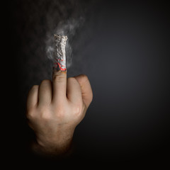 stop smoking concept. cigarette like a middle finger