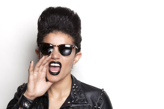 Screaming woman wearing sunglasses and leather jacket