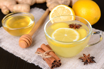 Healthy ginger tea with lemon and honey on table close-up