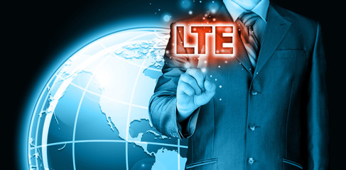 businessman is pushing his finger on lte button
