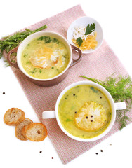 Tasty soup in saucepans, isolated on white