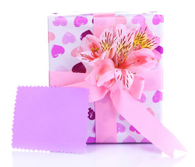 Pink gift with bow and flower isolated on white