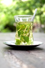 Herbal tea in traditional glass.