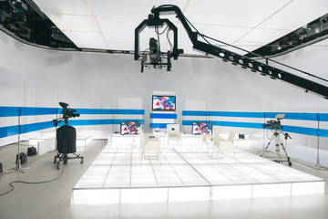 Television studio with jib camera and lights