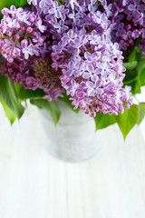 beautiful lilac on white wooden surface