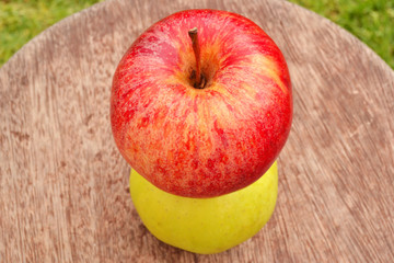 Two apples on the wood