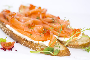 sandwiches with salmon caviar and greens adorned