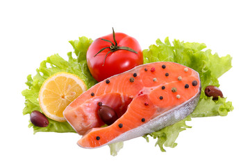 Salmon steak, vegetables isolated on white background