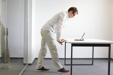 wrists exercise during office work - man with tablet