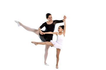 young girl ballerina learning dance lesson with ballet teacher