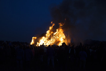 Fototapeta na wymiar huge bonfire, a tradition with easter in North-West Europe.