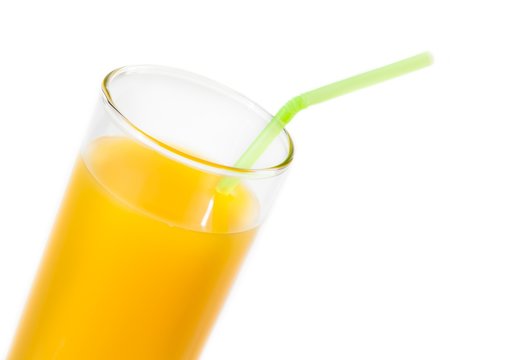 full glass of orange juice with straw with space for text