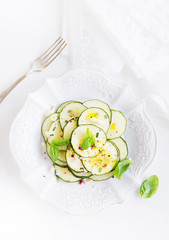 Zucchini salad with mozzarella, basil and olive oil
