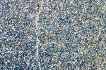 Multicolored granite with crack.