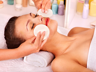 Woman getting  facial massage .