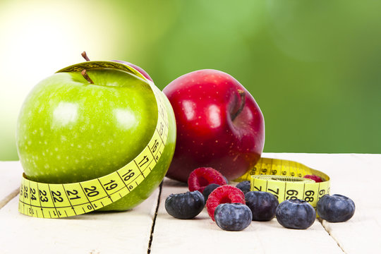fresh fruit with measuring cintra concept of healthy diet