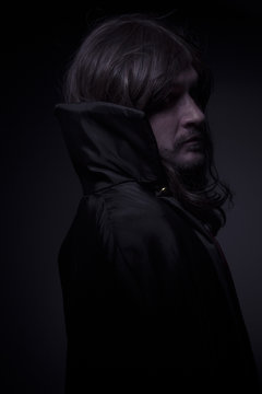 Goth, man with long hair and black coat