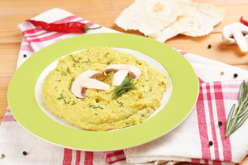 Bowl of tasty fresh hummus, close up