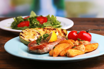 Grilled steak, grilled vegetables and fresh green salad