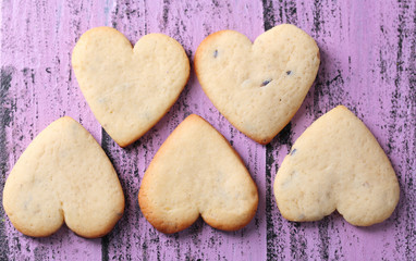 Lavender cookies on color wooden background