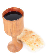 Cup of wine and bread isolated on white