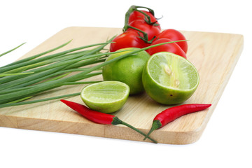 vegetable on a chopping board and the knife isolated