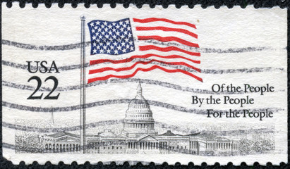 stamp printed in the USA, shows a Flag over Capitol Dome