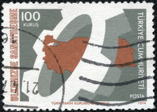 stamp printed by Turkey, shows cogwheel and map of Turkey