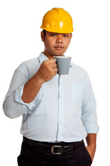Asian engineer man drinking a cup of coffee look at camera