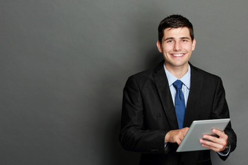 Young businessman using tablet pc