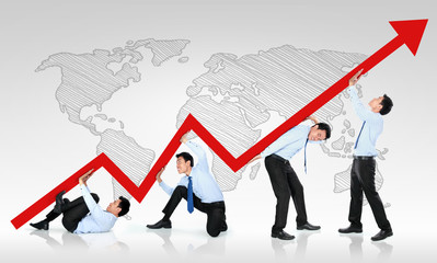 Fototapeta premium business man pushing a business graph upwards