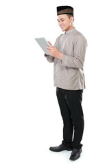 muslim man holding tablet pc