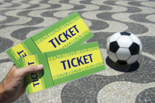 Hand Holding Brazil Tickets w Football Copacabana Rio Brazil