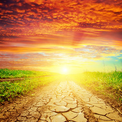red sunset over drought road