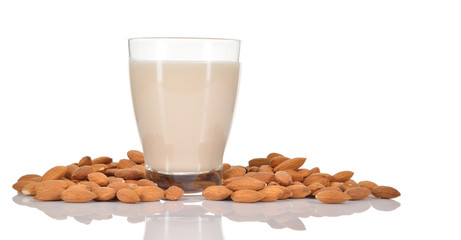 Almond milk on white background.