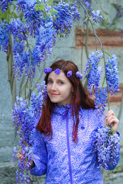 girl and blooming glicinia