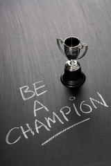 Be A Champion with a silver trophy cup for the winner