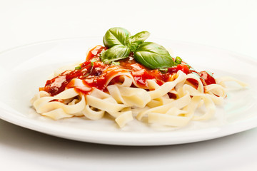 Pasta fettuccine with tomato sauce and basil