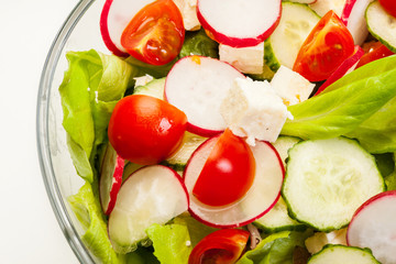 Fresh vegetable salad with cucumber and radish