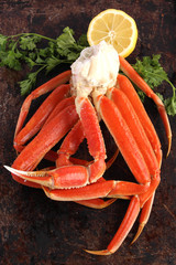 Crab legs on brown background - 65196386
