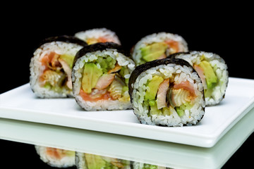 Japanese rolls close-up on black background. horizontal photo.