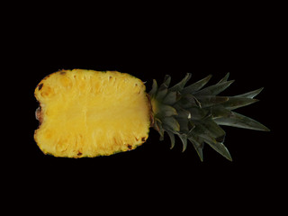 Pineapple slice on the black background