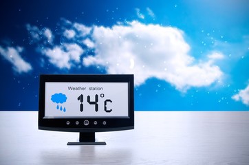 Weather station device with weather conditions outside backgroun