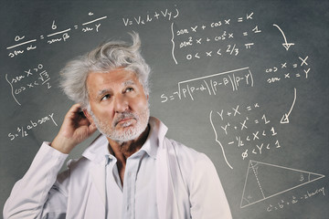 Scientist with mathematics formulas © captblack76
