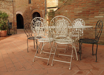 vintage iron  garden furniture on tuscan patio, Certaldo