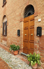 picturesque italian doorway in tuscan borgo Certaldo Alto