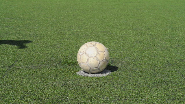 Businessman playing with soccer ball